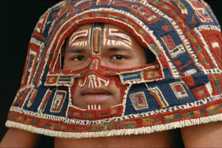 Face, shoulders, chest covered in openwork Inca embroidery. Raw, unedited image.