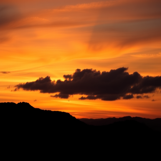 Generate a high-quality silhouette image of a mountain landscape during sunset using a DSLR camera, 24mm lens, aperture f/8, ISO 100, and a low angle view to enhance the depth and richness of colors in the sky.