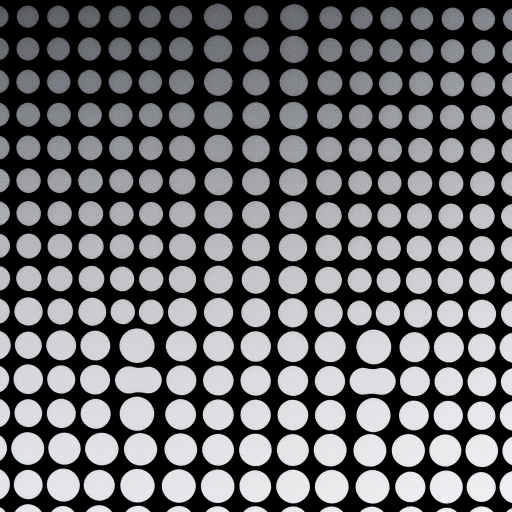 Generate a high-resolution image of a pattern featuring evenly spaced black and white dots, with a gradient effect from small to large, captured using a DSLR camera at f/8 aperture, ISO 100, 1/60 shutter speed, top-down view, utilizing macro lens for enhanced detail.