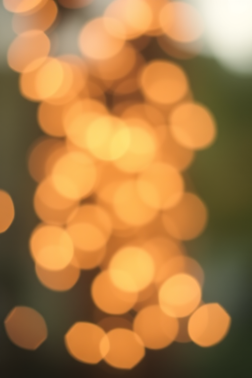 Create a soft-focus background with bokeh lights in warm tones, using a DSLR camera with a 50mm f/1.8 lens, aperture set to f/2.8, ISO 200, and a shallow depth of field.