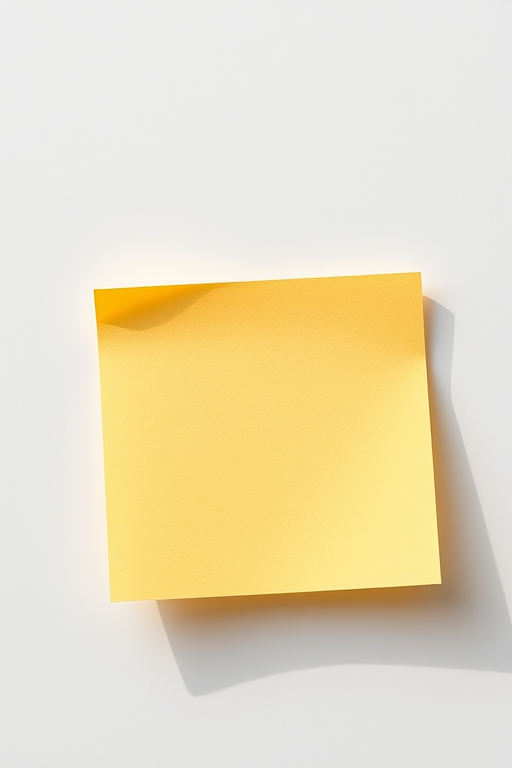 Create a high-resolution image of a yellow sticky note with a slightly textured surface, soft natural lighting, 50mm lens, f/2.8 aperture, ISO 200, captured from a top-down view in a minimalistic style using a DSLR camera.