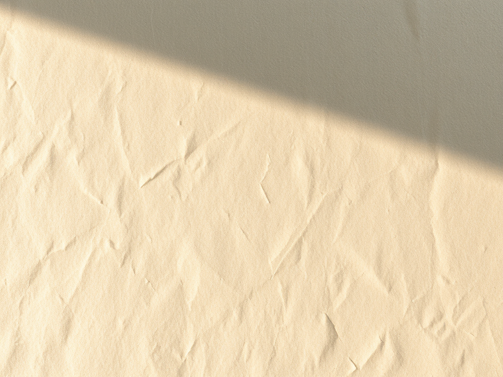 create a high-resolution parchment paper texture with soft lighting, shot with a Canon EOS R5 at f/2.8, ISO 100, 50mm lens, top-down view, soft focus style.
