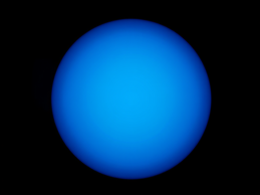 Create a high-resolution vector graphic of a blue circle centered inside a black circle with a clean background, using a Canon EOS R5, 50mm lens, f/1.8 aperture, ISO 100, shot from a straight-on view to ensure sharp focus and vibrant colors.