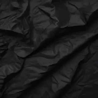 crinkled black paper