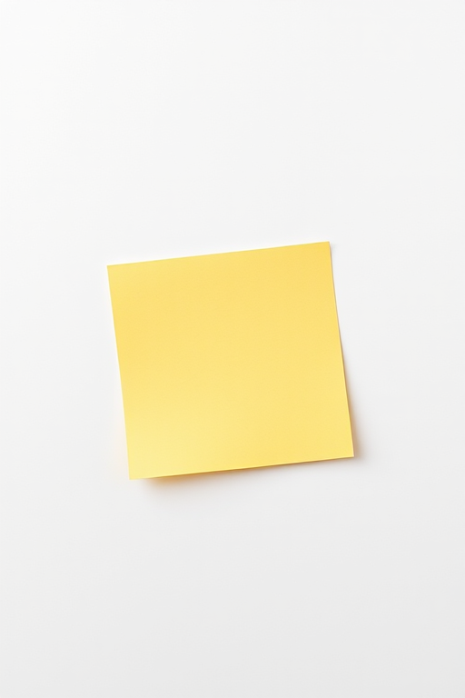 yellow sticky note on a white background, 50mm lens, f/2.8 aperture, ISO 100, top-down view, digital style, DSLR camera