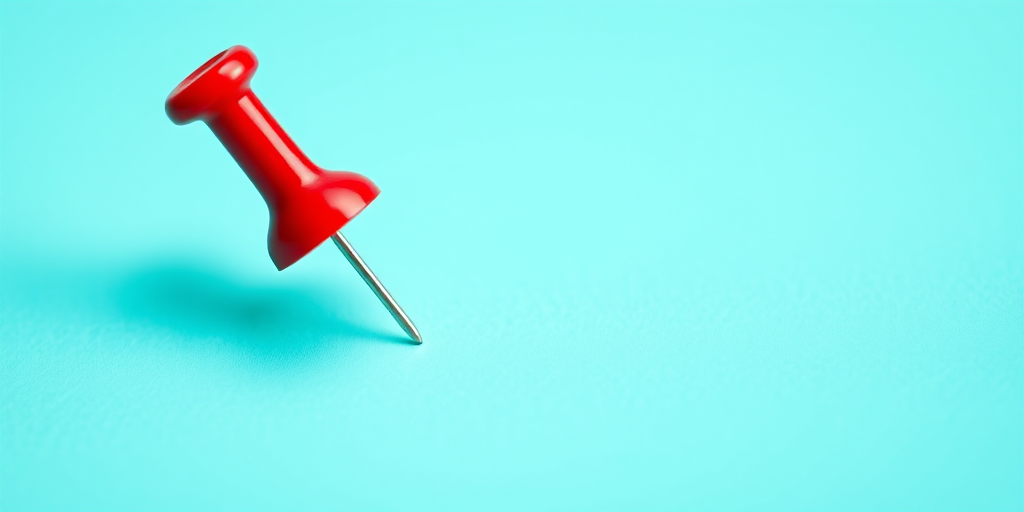 Create a vibrant image of a red pushpin on a teal circular background, using a DSLR camera with a 50mm lens, aperture set to f/1.8 for shallow depth of field, ISO 100 for minimal noise, and a soft focus effect to enhance visual appeal.