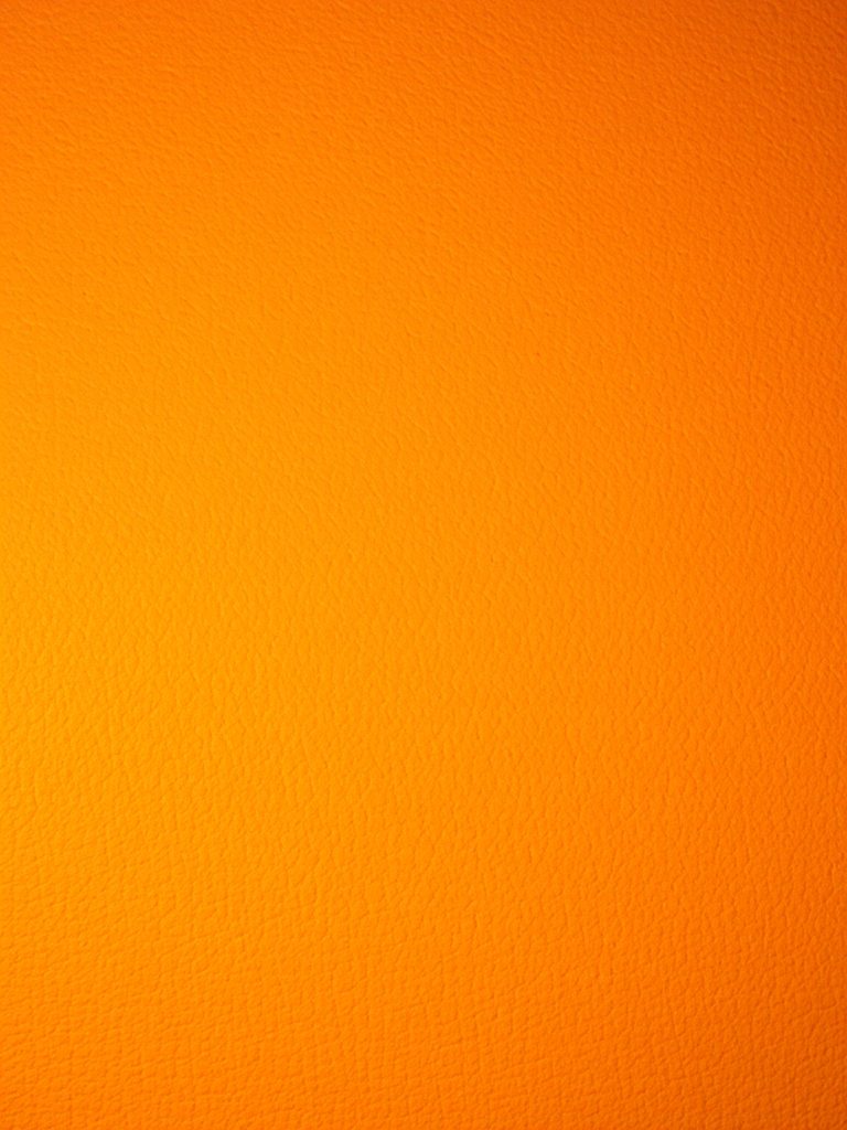 Create a textured orange background with a soft, warm appearance using a digital camera, 50mm lens, f/4 aperture, ISO 100, and a slight vignette effect for depth.