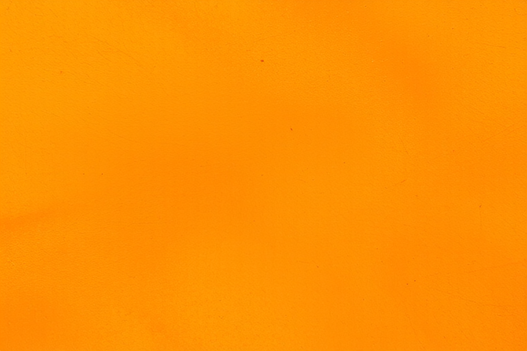 create a vibrant orange abstract texture background with subtle shades and variations, focus on enhancing surface depth and richness, captured with a DSLR camera at ISO 100, aperture f/8, shutter speed 1/60 sec, 50mm lens, natural lighting, slightly angled top-down view for dynamic effect