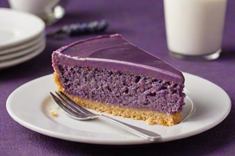 Create an image of a slice of purple dessert on a plate, featuring a smooth, glossy frosting on top. The dessert should have a light, fluffy texture and be presented with a fork beside it. The background should be simple and softly lit to highlight the dessert.