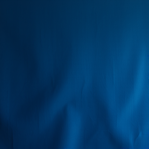 Generate a high-resolution abstract texture of a dark blue background with subtle variations in tone, shot with a Canon EOS R5 at f/8 aperture, 50mm lens, ISO 100, in soft natural lighting to enhance depth and detail.