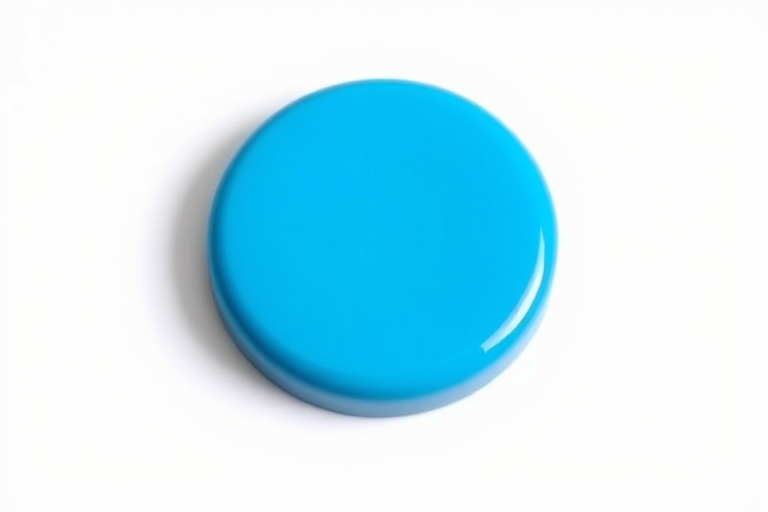A glossy blue button on a white background, captured with a DSLR camera set to f/5.6, ISO 100, with a 50mm lens at a straight-on view, using soft natural lighting.
