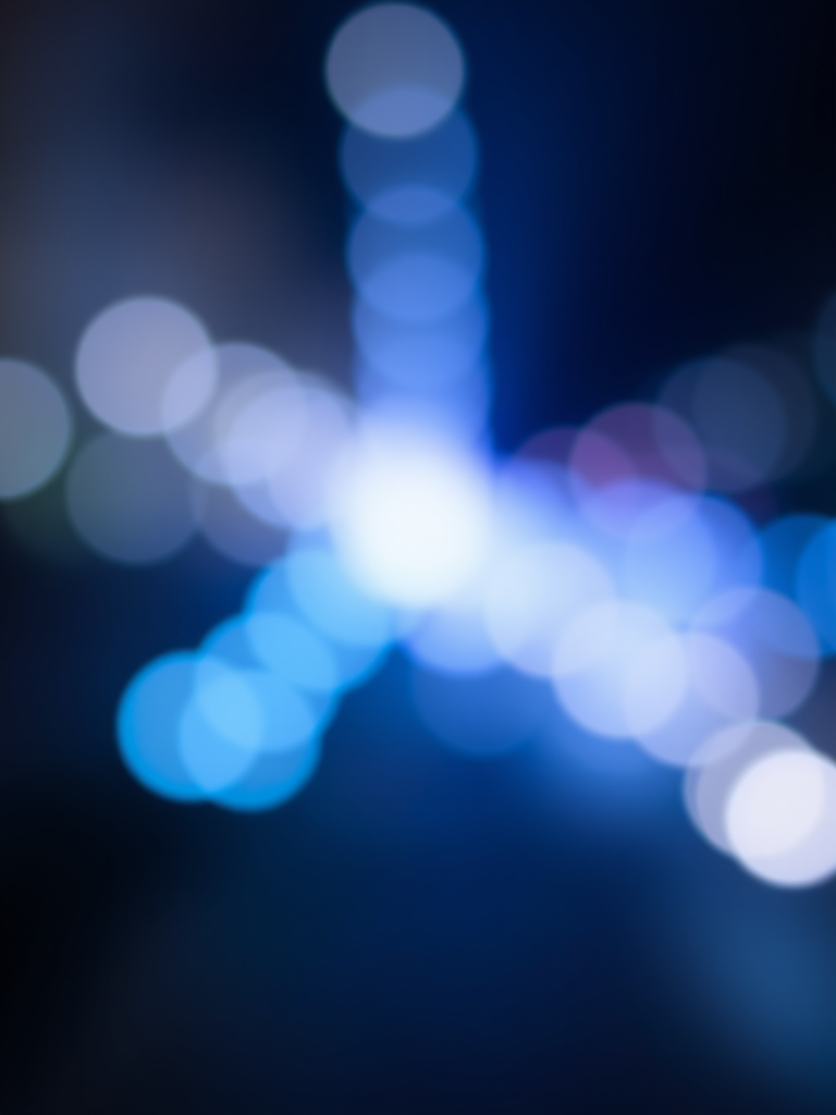 create a soft focus abstract background with blue bokeh effect, shot with a Canon EOS R5, aperture f/2.8, shutter speed 1/125s, ISO 100, using a shallow depth of field and a wide-angle lens to enhance image quality.