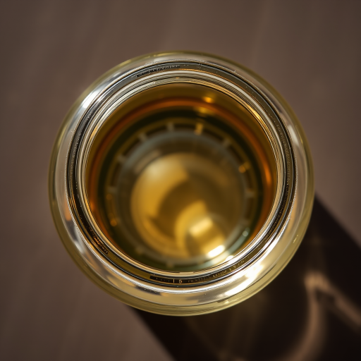Create a high-resolution image of a transparent glass jar, showcasing its reflective surfaces and details, shot with a Canon EOS R5 camera, 50mm lens, aperture f/1.8, ISO 100, using top-down view and natural soft lighting to enhance clarity and minimize shadows.