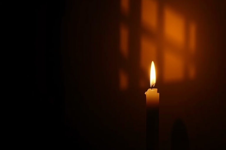 Softly focused image of a single candle flickering in the dark, soft golden light casting long shadows on the walls, with a sense of stillness and calm filling the air.