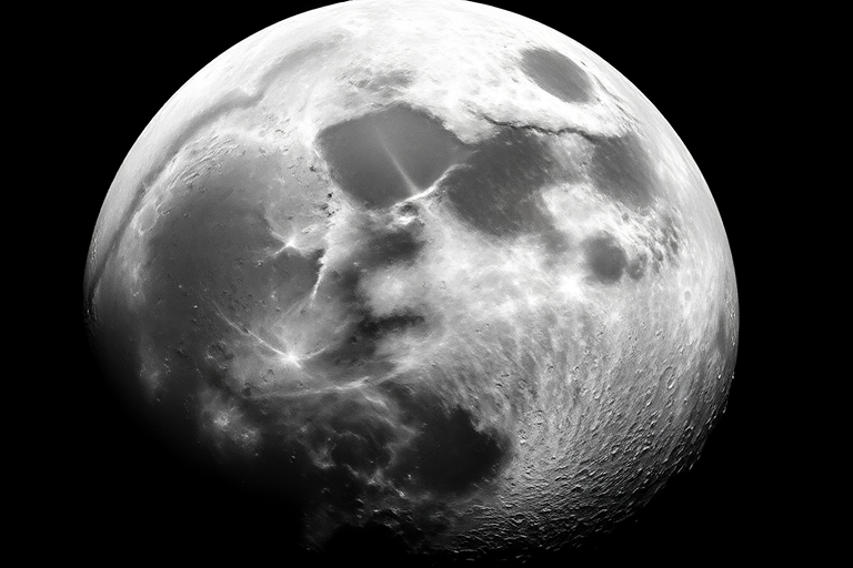 Create a high-resolution image of a textured moon with detailed craters and surface features, using a DSLR camera with a 50mm lens, aperture f/8, ISO 100, and a shutter speed of 1/125 sec, capturing the scene from a slightly elevated angle for depth, emphasizing the intricate details and tonal variations in grayscale.