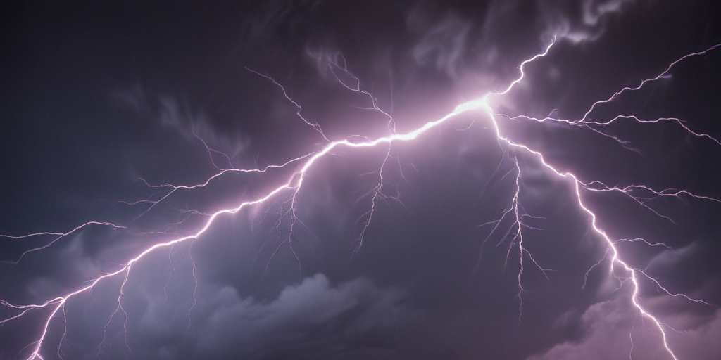 Majestic Display of Lightning Illuminating a Dark Stormy Sky at Night