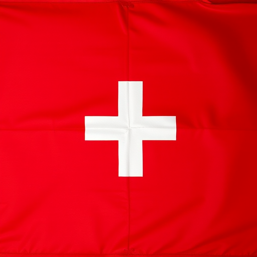 Create a high-resolution image of a red flag with a white cross centered on it, using a DSLR camera with a 50mm lens, aperture f/2.8, ISO 100, and a slight overhead view for enhanced detail and vibrancy.
