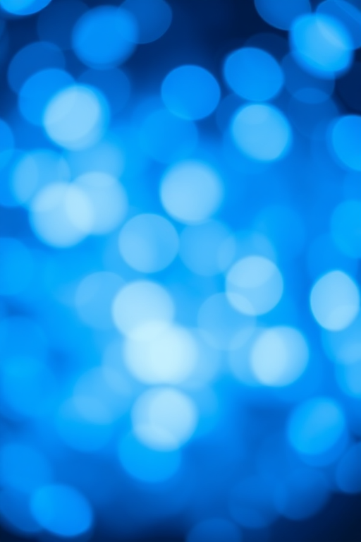 create a bright blue bokeh background with sparkling white highlights, using a Canon EOS 5D Mark IV, aperture f/2.8, ISO 100, shutter speed 1/125s, shot from a slight upward angle with a shallow depth of field for a dreamy effect