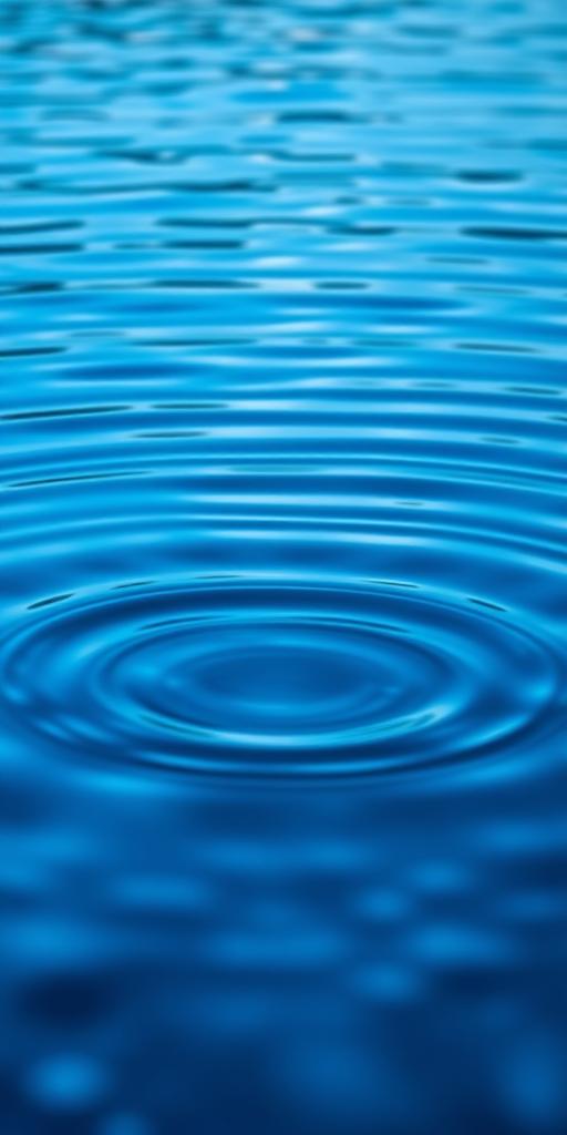 Create an abstract image of blue water ripples with a smooth gradient background, using a Canon EOS R5 camera, 50mm lens, aperture f/1.8, shutter speed 1/200s, ISO 100, shot from a low angle to emphasize depth.