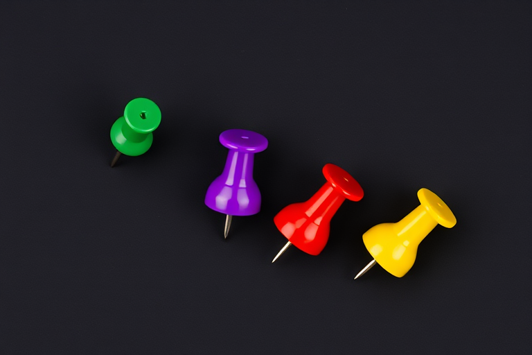 Create a high-resolution image of four colorful pushpins (green, red, purple, and yellow) arranged in a diagonal line on a plain black background, using a DSLR camera with a 50mm lens, f/2.8 aperture, ISO 100, and natural lighting for clarity.