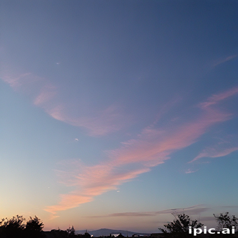Soft Pastel Clouds Against a Serene Evening Sky at Dusk