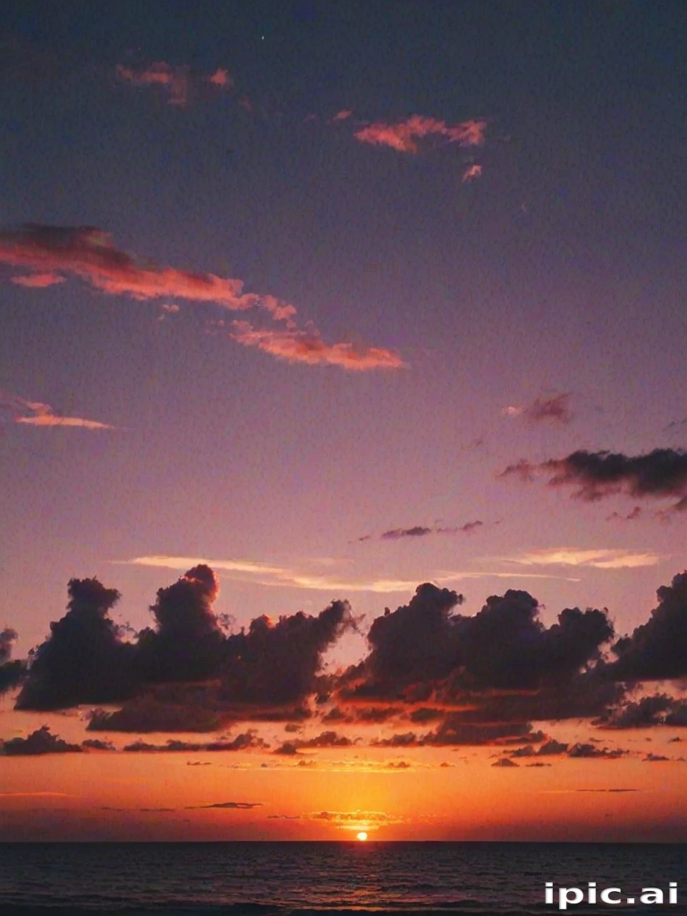 Stunning Sunset Over the Ocean with Colorful Clouds and Twilight Sky