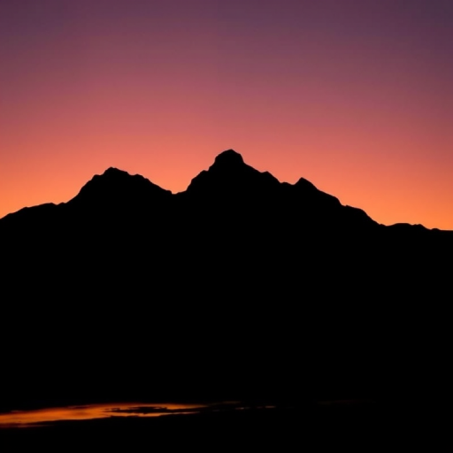 Create a minimalistic black silhouette of a mountain landscape during sunset, capturing warm colors in the sky, using a DSLR camera with a 50mm lens, aperture set to f/2.8, ISO 100, and a shutter speed of 1/125s, shot from a low angle for dramatic effect.