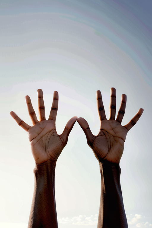 Two Hands Raised Towards the Sky, Symbolizing Hope and Unity.