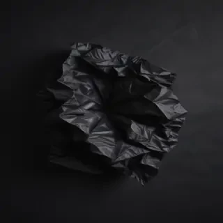 black crumpled paper