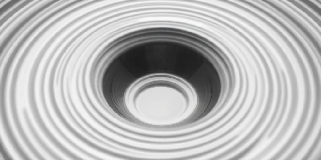 Create an abstract image of concentric circles and ripples in shades of gray and white, using a Canon EOS R6 camera, with an aperture setting of f/4, a shutter speed of 1/250s, ISO 100, taken from a low angle view to emphasize depth and texture, with a focus on clarity and smooth gradients.
