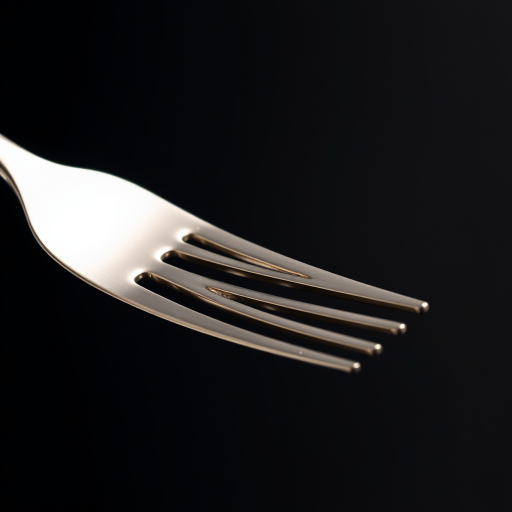 Create a high-resolution image of a polished silver fork against a black background, using a 50mm lens, f/1.8 aperture, ISO 100, with soft diffused lighting and a macro photography style to enhance details and reflections.