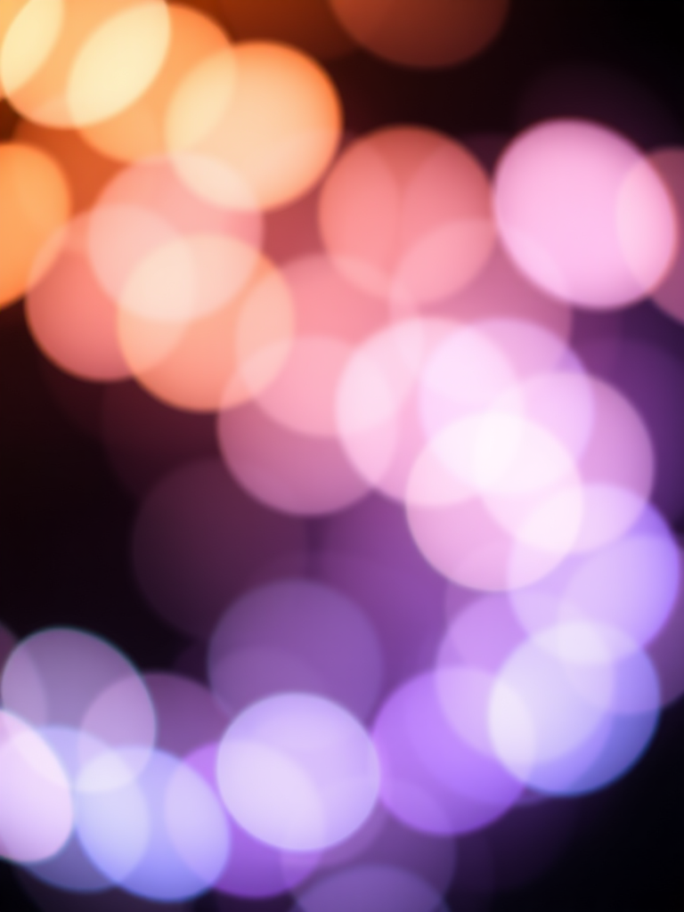 high-resolution abstract background of soft glowing bokeh circles in various pastel colors on a black background, captured with a DSLR camera at f/2.8 aperture, 50mm lens, ISO 100, in a shallow depth of field, using a macro photography style