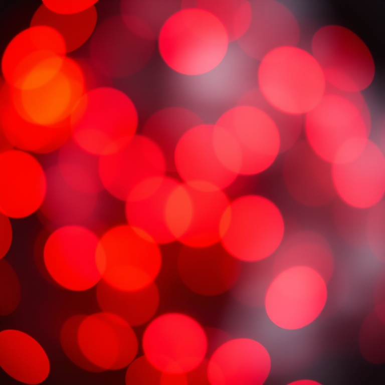 Create a vibrant abstract image of glowing orbs in shades of red and orange with a blurred bokeh effect, shot with a Canon EOS R5, 50mm lens, f/1.8 aperture, ISO 200, 1/60s shutter speed, and a soft focus background.