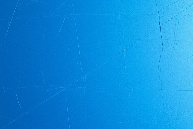 Create a high-resolution textured background featuring a scratched and metallic blue surface with soft lighting, using a DSLR camera, 50mm lens, aperture f/2.8, ISO 100, shutter speed 1/60 sec, taken from a straight-on view for clarity and detail.