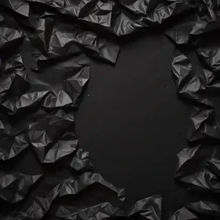 black crumpled paper