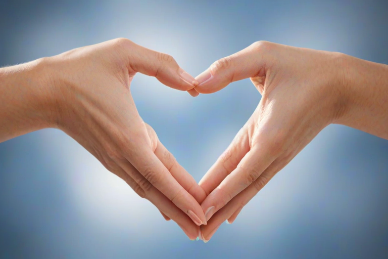 hands forming a heart shape against a blurred background