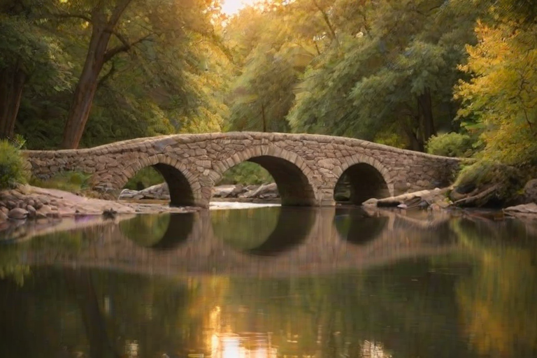Soft-focus image of an ancient stone bridge arching over a serene river, with soft golden light from the setting sun casting a warm glow on the water and surrounding trees.