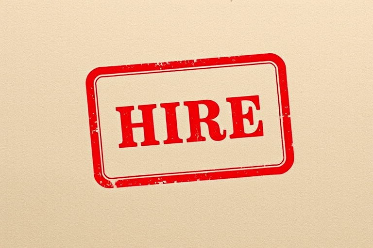 Create a high-resolution image of a bold red stamp with the word HIRE centered inside a rectangular border, using a DSLR camera, f/2.8 aperture, ISO 100, 50mm lens, and a top-down view to enhance clarity and detail.