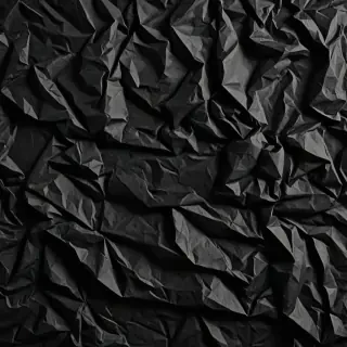 black crumpled paper