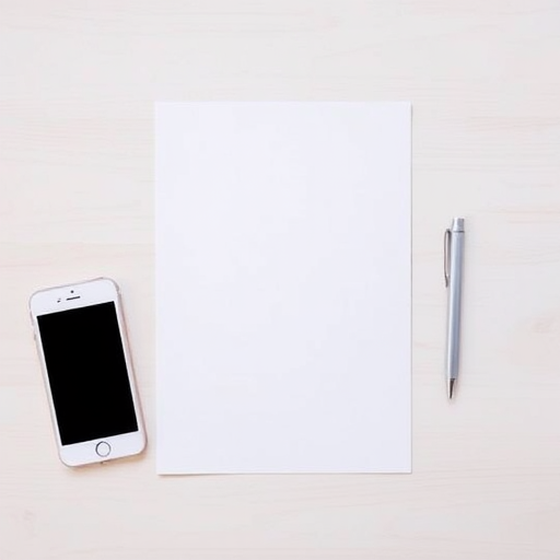 A minimalist workspace featuring a blank sheet of paper, a white smartphone, and a silver pen on a light wooden surface, captured with a DSLR camera at f/2.8 aperture, 1/60 shutter speed, ISO 100, top-down view, natural lighting.