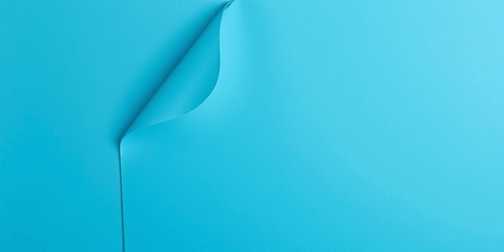 Create an image of a blue document with a folded top corner, in a clean and modern design, captured with a Canon EOS R5 at f/4, ISO 100, 1/125s, top-down view, using a soft focus lens for a professional look.