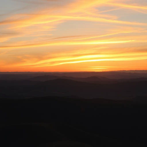 Generate a high-resolution image of a serene landscape featuring rolling hills and a sunset sky with warm colors using a DSLR camera with a 50mm lens, aperture set to f/8, shutter speed of 1/200 seconds, ISO 200, shot in landscape mode.