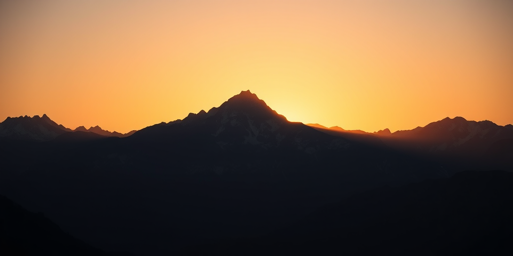 Create a high-resolution silhouette of a majestic mountain range at sunrise, shot with a Canon EOS 5D Mark IV, 50mm lens, aperture f/8, ISO 100, with a wide-angle view, in soft natural light to enhance the contours and textures of the mountains.