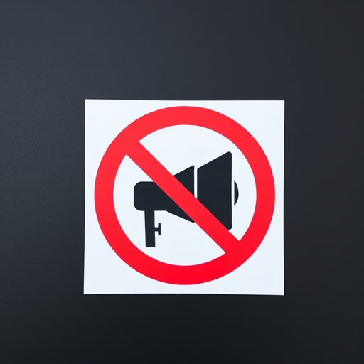 Create an image of a no loudspeaker symbol featuring a black loudspeaker inside a red circle with a diagonal line crossing it, captured with a DSLR camera at f/8 aperture, ISO 100, 50mm lens, natural lighting, top-down view for clarity and detail.