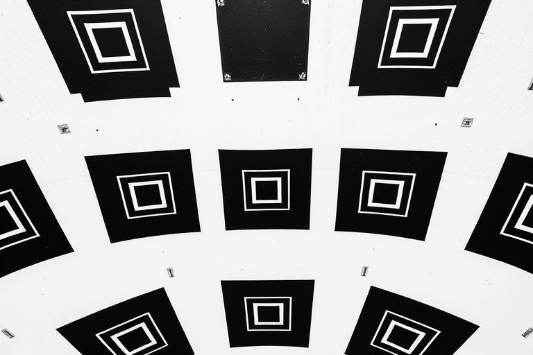 Create a high-resolution image of a black and white checkerboard pattern with spiraling squares, using a DSLR camera with a 50mm lens, aperture set to f/8, ISO 100, and a symmetrical overhead view to enhance depth and contrast.