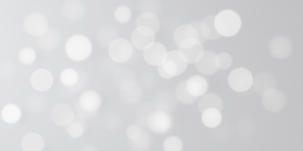 Create a high-resolution image of a soft bokeh background with varying sizes of white and light gray circles on a faint gray backdrop, captured with a DSLR camera at f/2.8 aperture, ISO 100, shutter speed 1/60 sec, using an 85mm lens from a close-up view to enhance depth and detail.