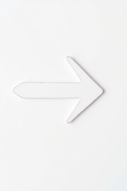 Create an image of an arrow pointing right, with a clean and simple design, using a DSLR camera type, 50mm lens, aperture set to f/2.8 for shallow depth of field, ISO 100 for clear details, natural lighting, and a focus on sharpness.
