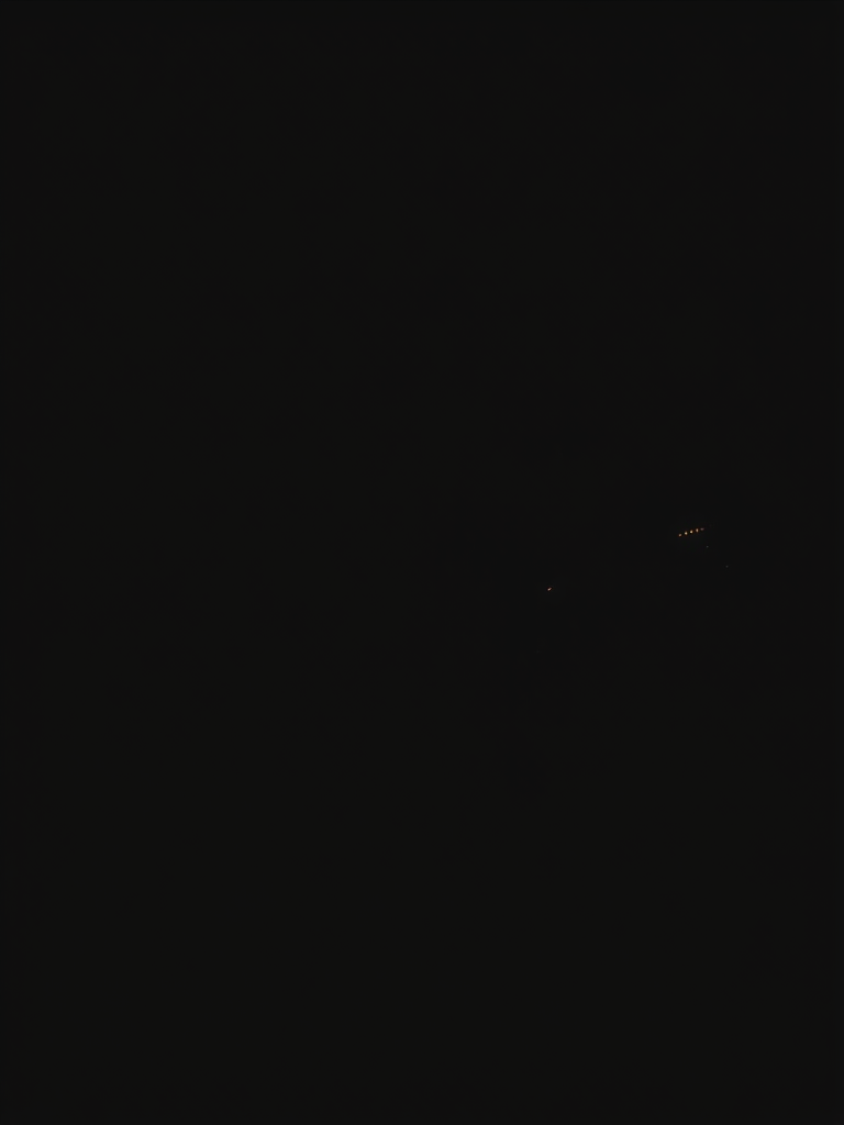 Generate a high-contrast silhouette of a guitarist playing an electric guitar on a black background, using a DSLR camera with a 50mm lens, aperture set to f/1.8, shutter speed 1/250 sec, and ISO 100 for enhanced clarity and sharpness, capturing from a low angle for a dynamic perspective.