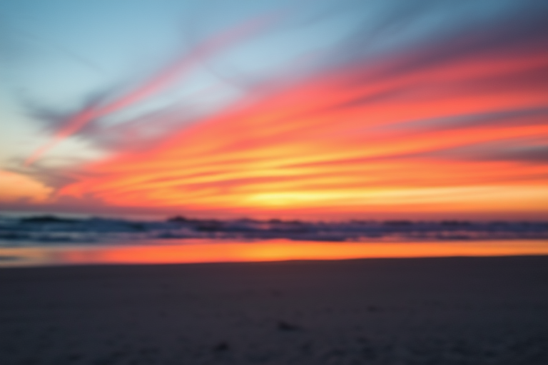 Generate an image of a calm beach sunset with vibrant colors, using a DSLR camera with a 50mm lens, aperture f/1.8, ISO 100, shutter speed 1/200s, in landscape view, with soft focus on the foreground and sharp detail on the horizon, capturing the serene atmosphere and natural beauty.