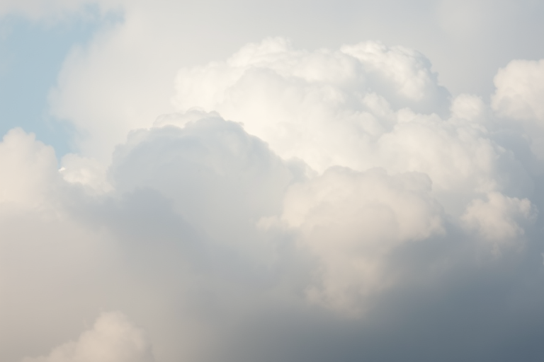 Create a high-resolution image of a soft, blurred cloud. Use a Canon EOS R5 camera with a 50mm f/1.2 lens, aperture set to f/2.8, ISO 100, shutter speed 1/250s, and shoot from a slightly elevated angle with a soft-focus effect to enhance the quality and smoothness of the cloud.